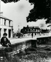 Boy sitting in wall.