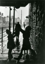 Children play under the bridge